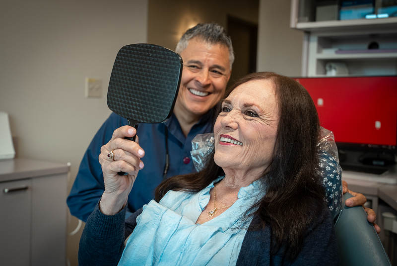 Barbara and Dr. Dorantes looking into mirror tight shot