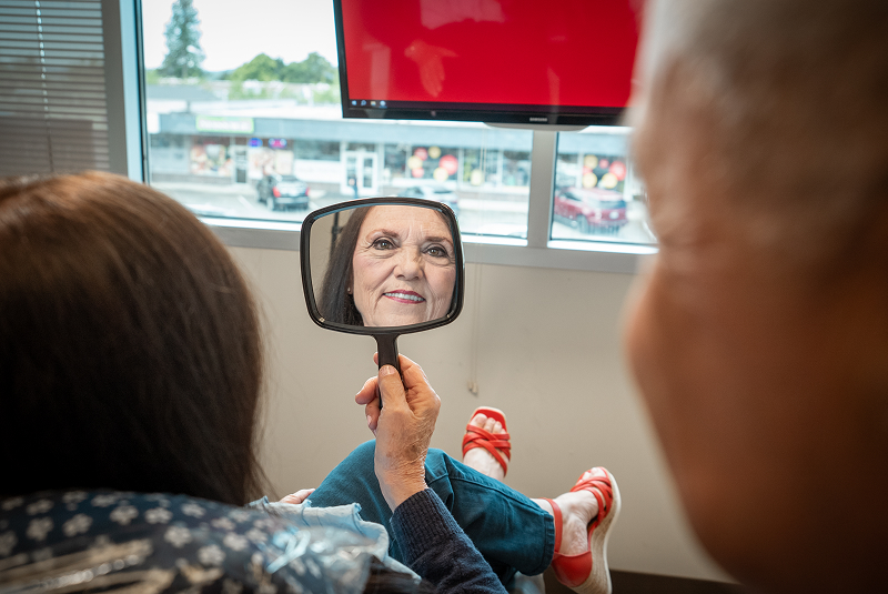 Barbara looking into mirror