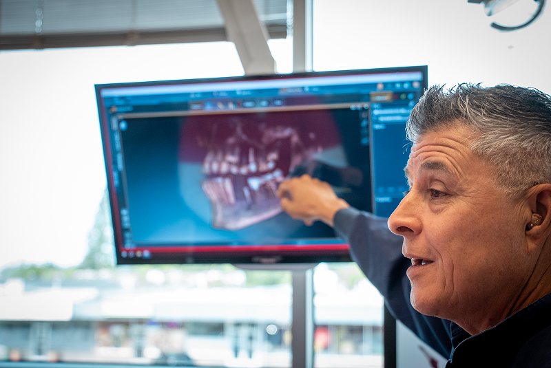 Dr. Dorantes pointing to digital xray on screen