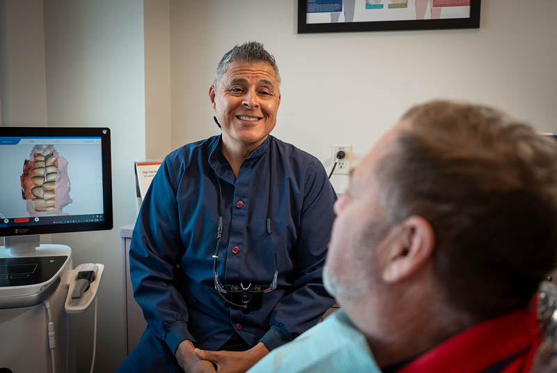 Dr. Dorantes talking to patient over shoulder