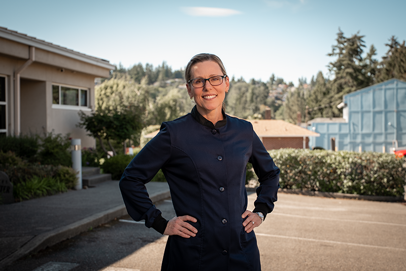 Dr. Kristin Vernon standing outside with hands on her hips