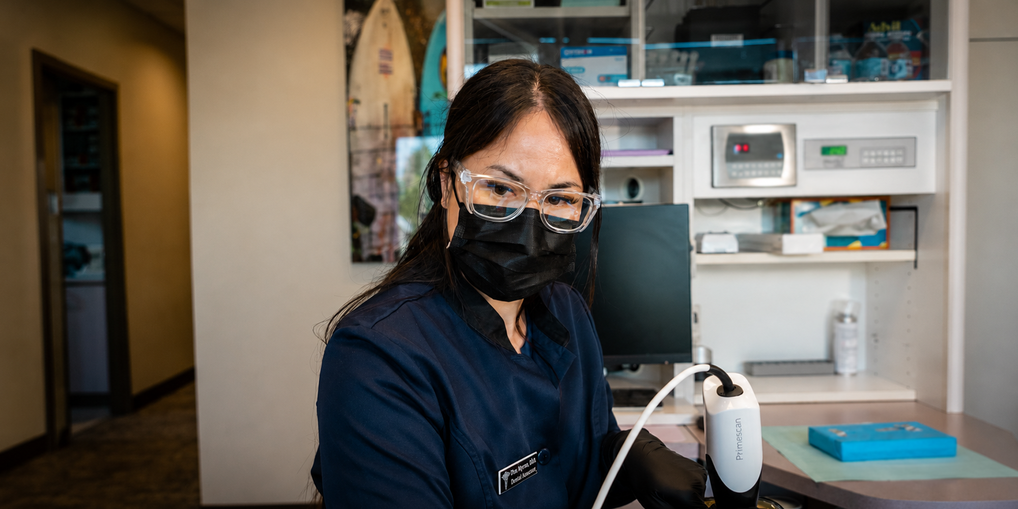 staff member conducting an exam on a patient